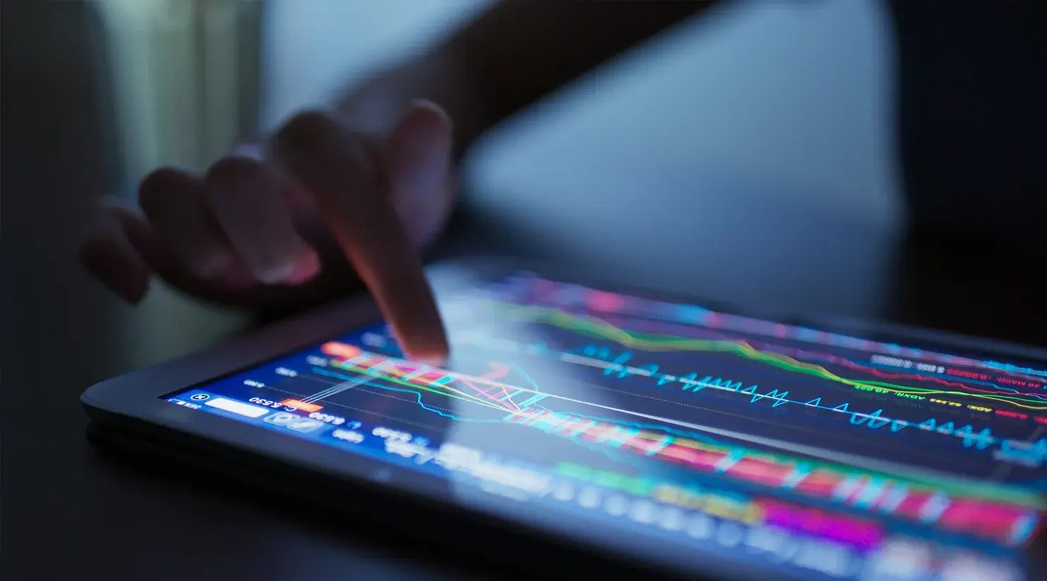 finger-touch-on-tablet-computer-with-stock-market-1